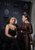 Makeup artist applying makeup to a model with branded backdrop