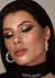 Elegant evening makeup featuring gold glitter accents in South Beach Miami.