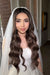 Elegant bride with long glossy Hollywood waves and flawless soft glam wedding makeup Miami created by a professional Miami makeup artist and hair stylist