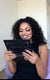Young woman with glamorous evening makeup looks in a mirror