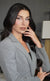 Elegant soft glam makeup in neutral beige tones for a professional business headshot